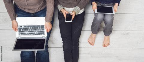 parent and children using devices
