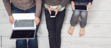 parent and children using devices